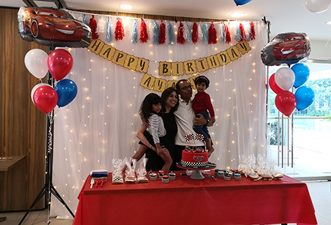 Party backdrop and balloon bouquets